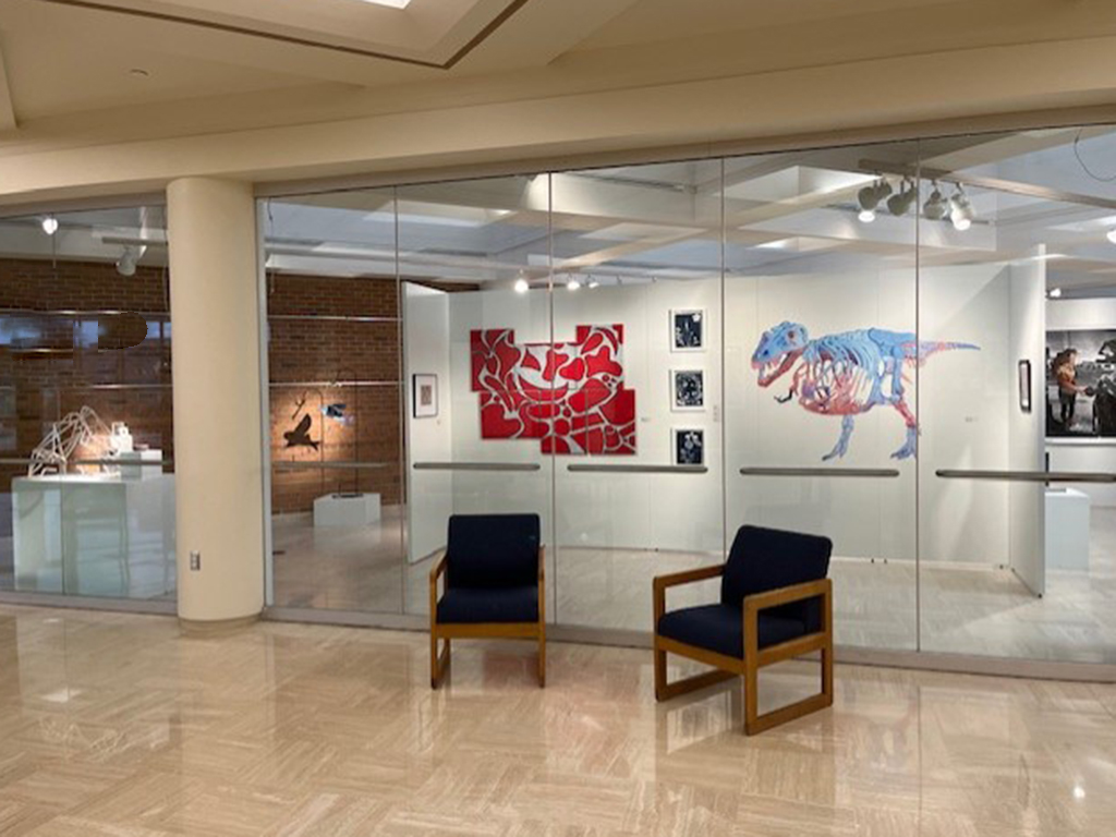 From lobby window of the student show with various works of art